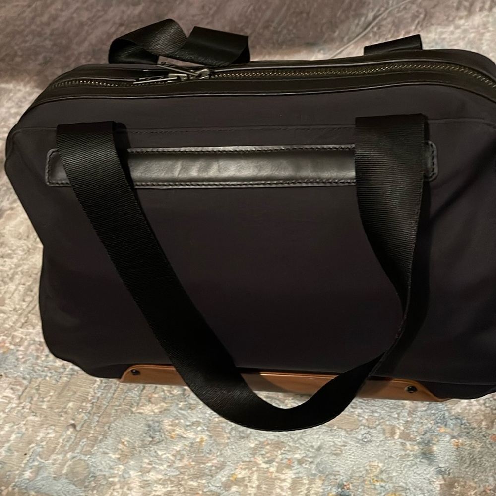 Puma handbag with unique wooden plate at the bottom